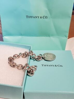 Return ToTiffany. Tiffany & Co. Silver Link Bracelet with Round Tag and Blue Box